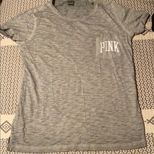 a grey “PINK” T-shirt